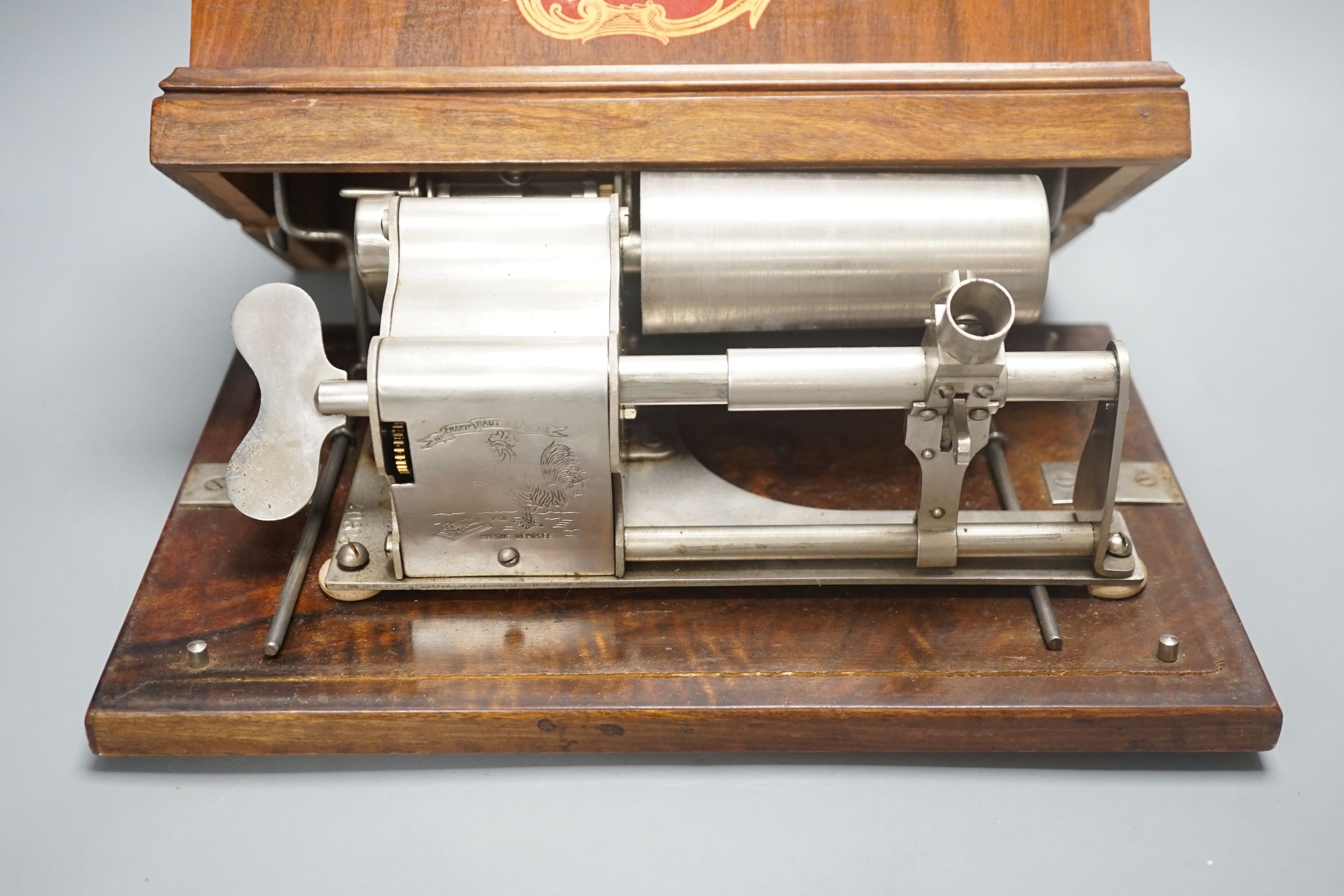 A Charles Pathé' cased phonograph, with separate aluminium horn, 30 cms wide.